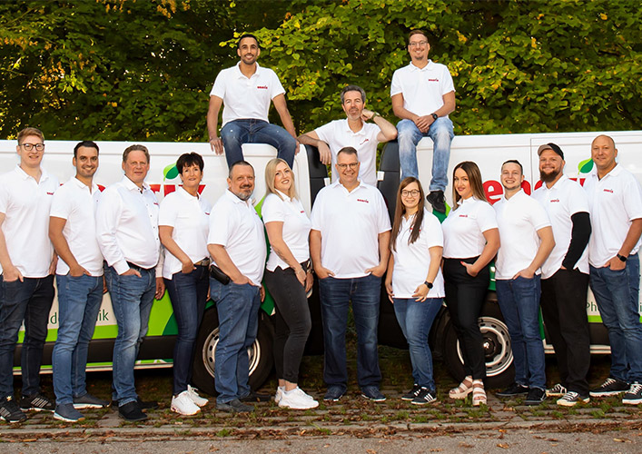 a group of people standing on top of a truck